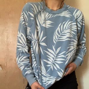 this is a medium white and blue pattern sweatshirt.